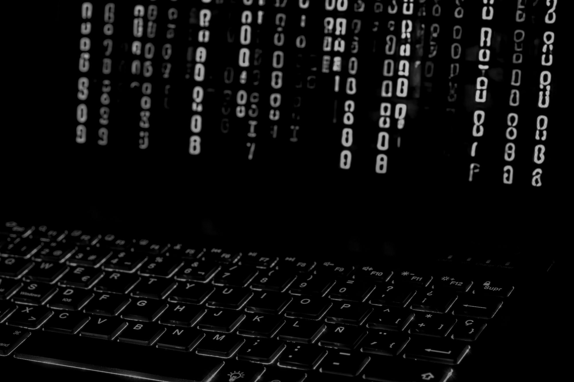 Streams of code on a dark screen